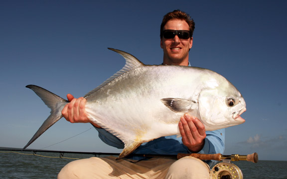 Former quarterback Todd Collins Holds his first Permit on Fly caught in Key West Florida.