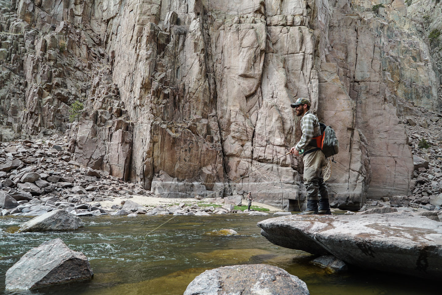 An angler fishes the rugged Fremont Canyon in central Wyoming