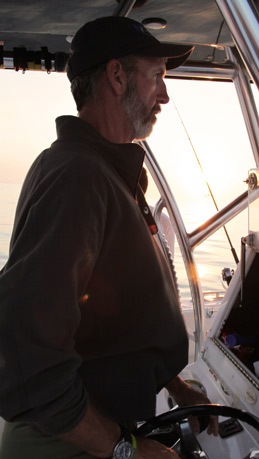 Captain Mike Weinhofer at the helm of his 40 foot Sea Hunter light tackle boat in Key West