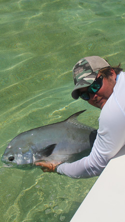 Capt. Jared Cyr holds a permit on fly off Key West